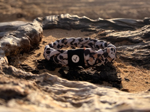 Versa Band resting on textured sandstone at golden hour