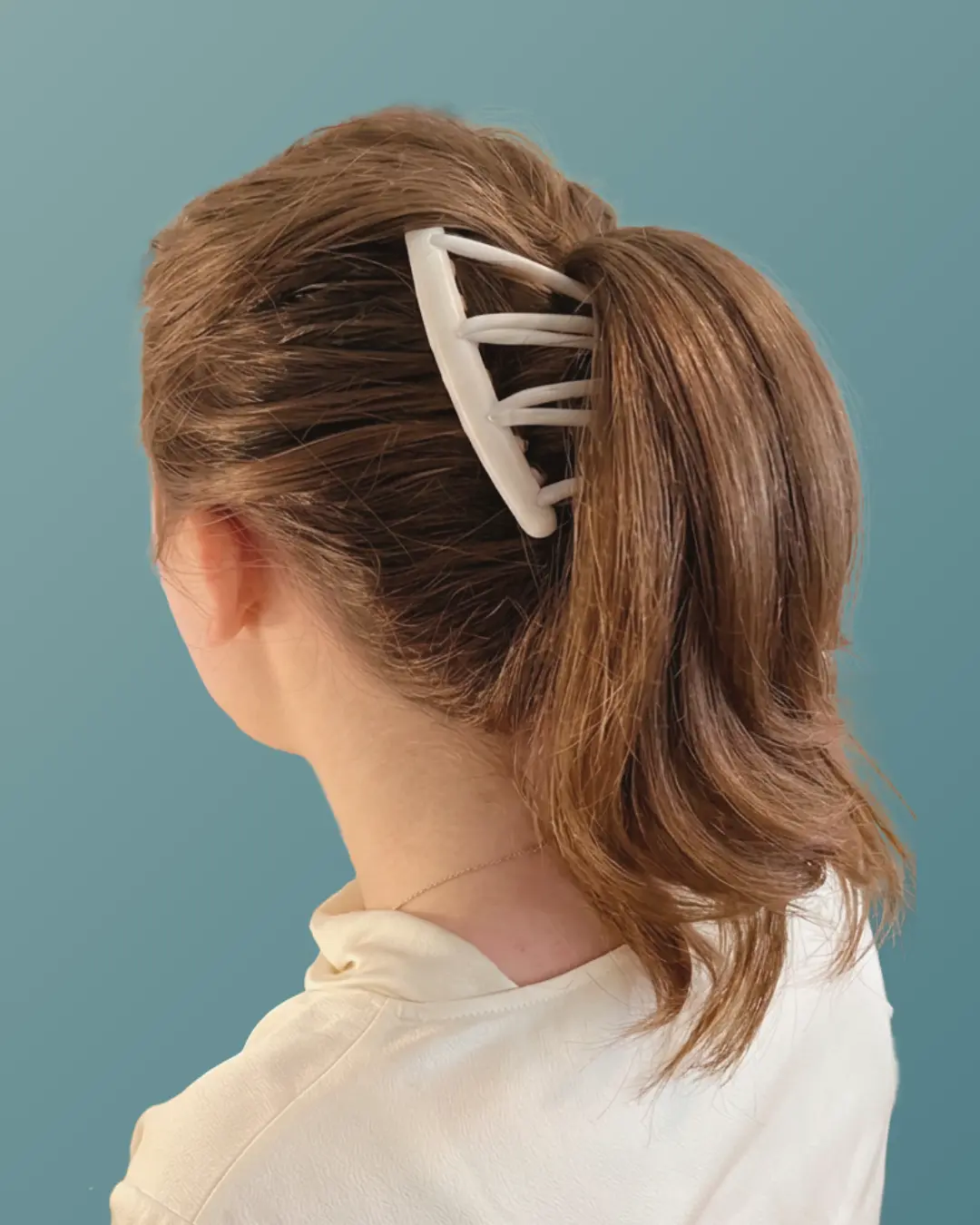 Halo Comb holding a low ponytail